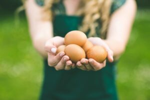 girl holding eggs