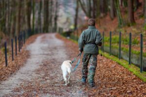 man walking dog